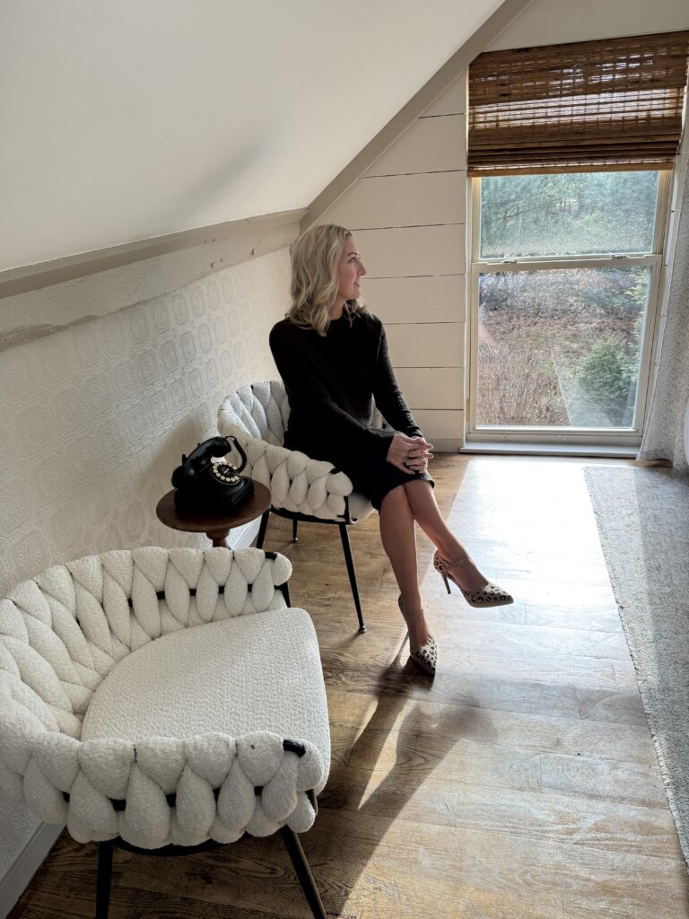 Amy looking off into the distance, reflective.